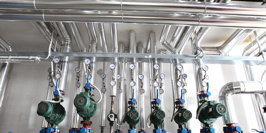 pump , manometer, pipes and faucet valves of heating system in a boiler room